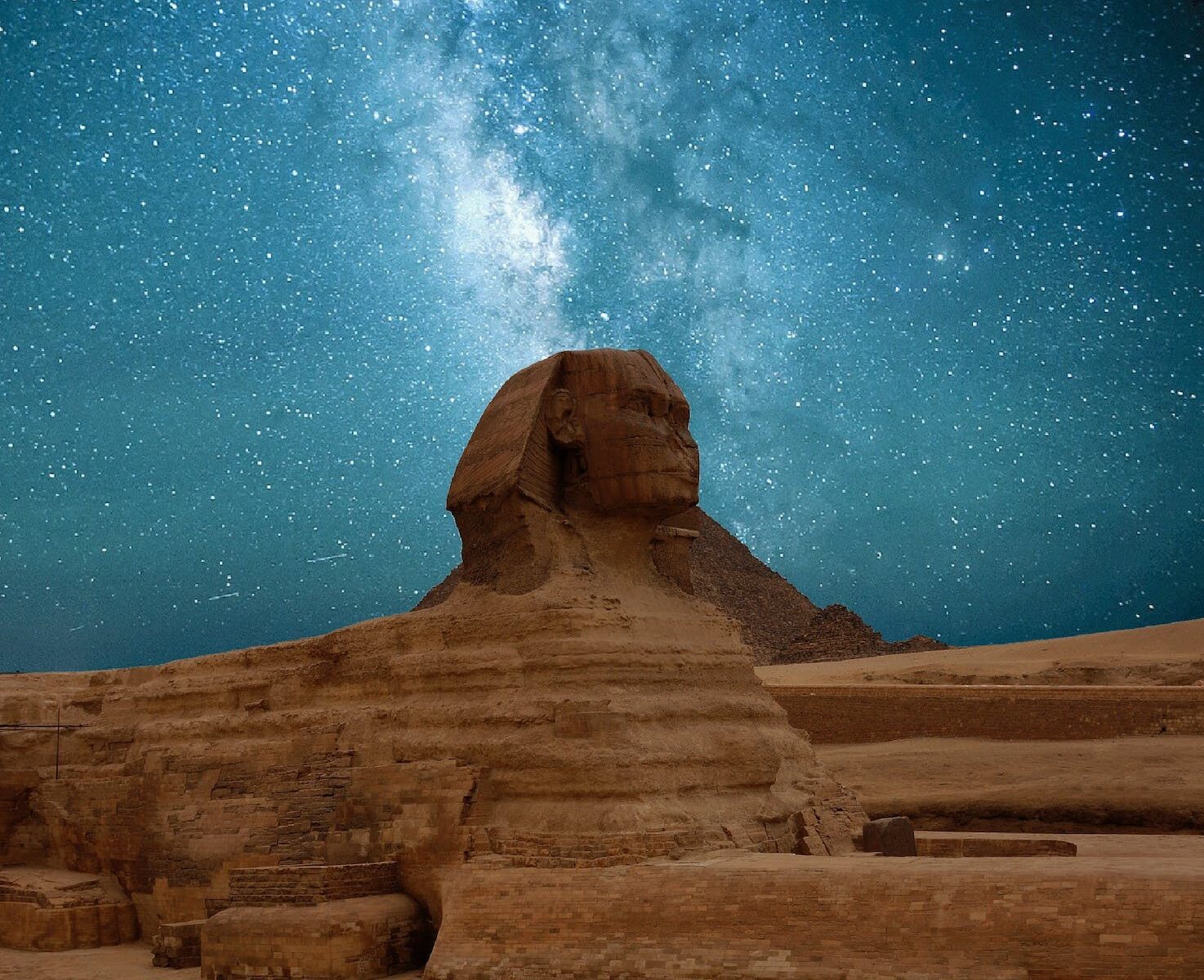 great sphinx of giza under blue starry sky