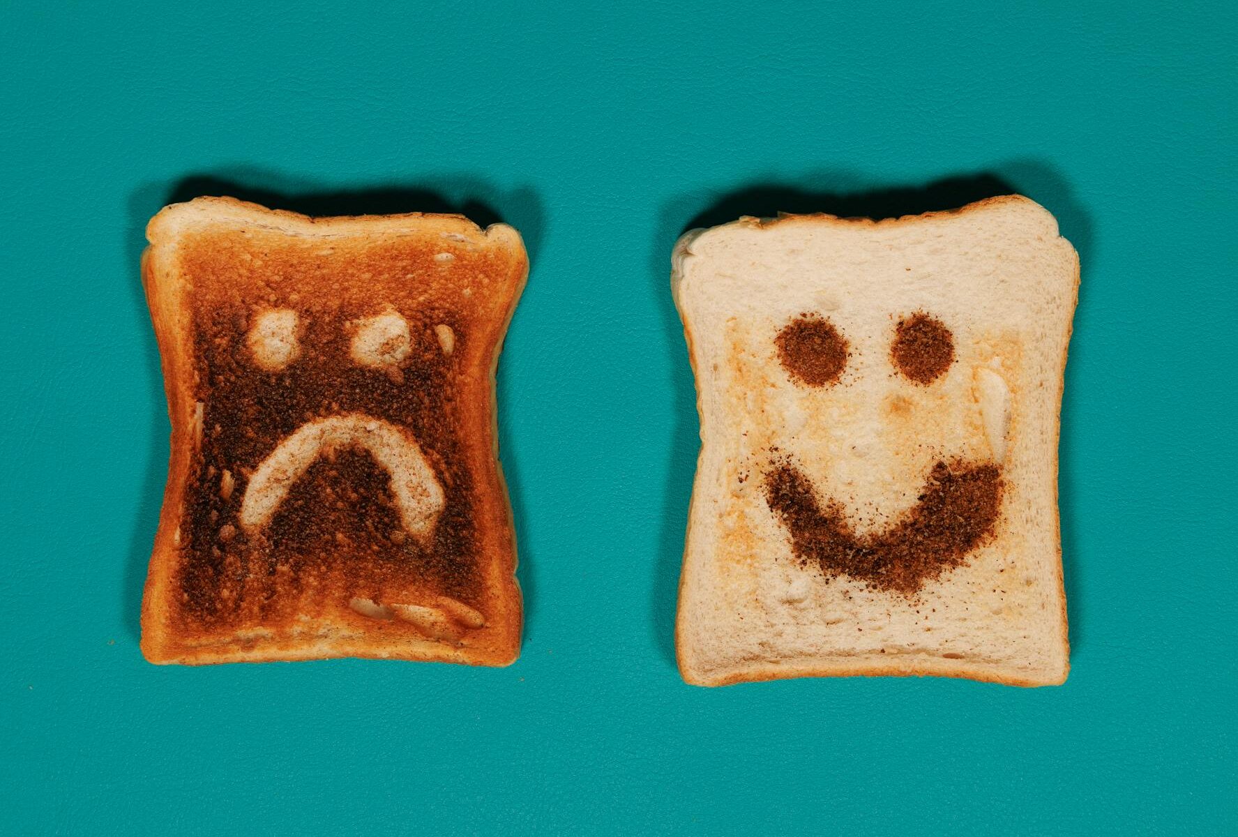 comparison of toasts with happy and sad faces