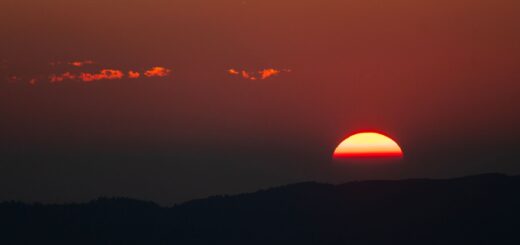 stunning red sunset over mountain horizon